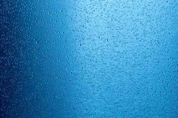 water drop on blue metal surface