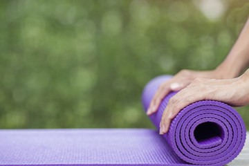 woman preparing for yoga