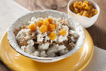 Cottage cheese with cloudberries and cereal flakes  .