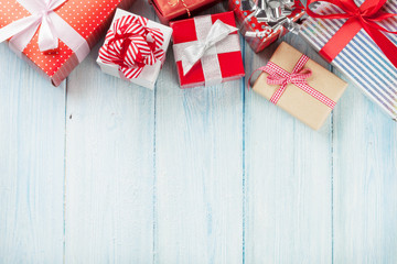 Christmas gift boxes on wooden table