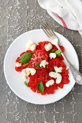 red tomato salad on plate