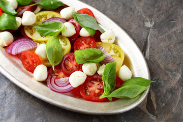 caprese salad on old plate