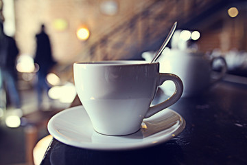 cup of tea at a cafe blurred background