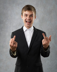 man is showing finger and laughing