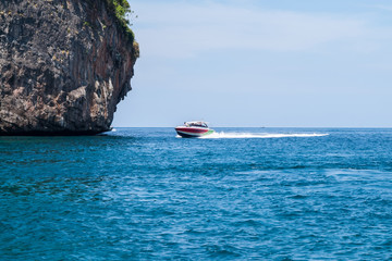 Speedboat comes to the rock