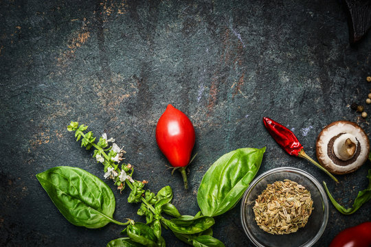 Basil and Tomatoes in rustic wooden background, ingredients for cooking 