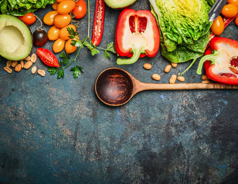Fototapeta Colorful organic vegetables with wooden spoon , ingredients for salad