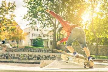 Young skateboarder practicing in the skate park in New york city