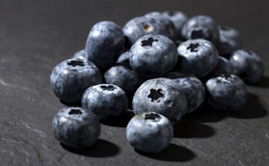 fresh blueberries on slate stone
