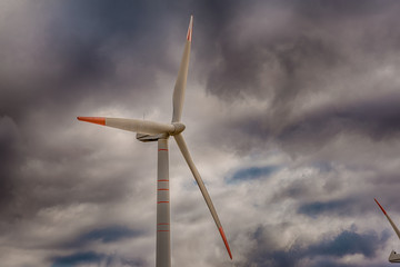 Wind Generator Turbines over cloud sky - Green Renewable Energy