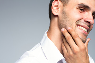 Obraz premium Portrait of handsome young man with clean face and happy smile