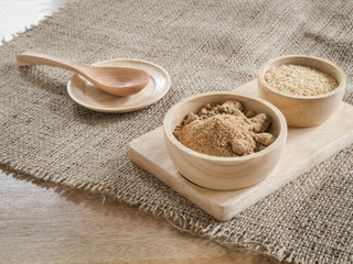 Brown sugar and wheat germ in wooden bowl