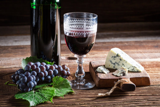 Tasty red wine with various cheese