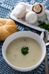 champignon soup in white bowl