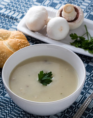 champignon soup in white bowl