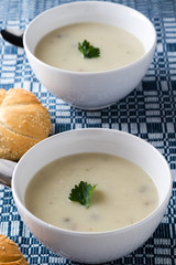 champignon soup in white bowl