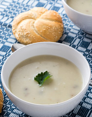 champignon soup in white bowl
