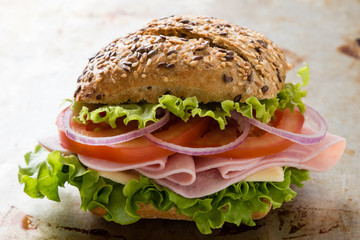 brown bun ham sandwich