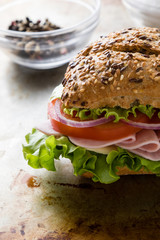 brown bun ham sandwich