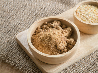 Brown sugar and wheat germ in wooden bowl