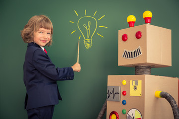 Kid with toy robot in school