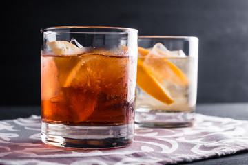 Old fashioned cocktails on the wooden background