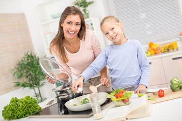Mother And Daughter In The Kitchen