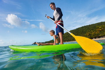 Father and daughter paddling