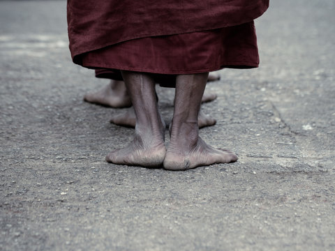 Dramatic picture of ascetic Buddhist monk walking pray at the wa