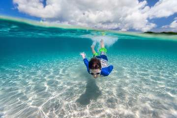 Little boy swimming in ocean