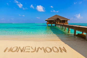 Word Honeymoon on beach