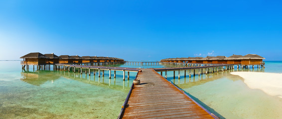 Bungalows on tropical Maldives island
