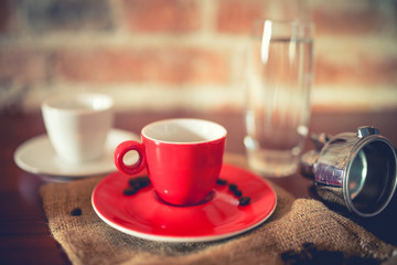 short espresso freshly brewed from coffee machine in pub, restaurant. Fresh coffee with details on vintage edit