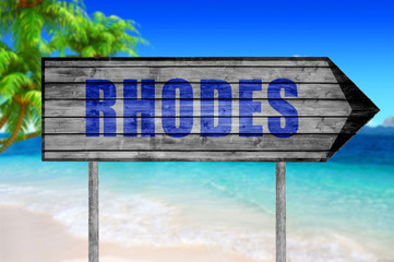 Rhodes wooden sign with beach background