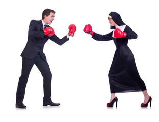 Nun with boxing gloves isolated on white