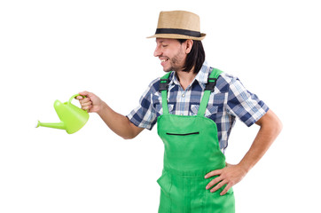 Young cheerful gardener with watering can isolated on white