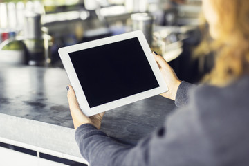 Girl with a tablet in hands