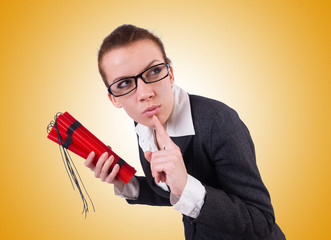 Businesswoman with dynamite on white