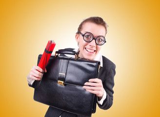 Businesswoman with dynamite on white
