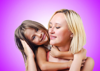 Happy mom and daughter on white