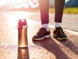 healthy lifestyle sports man tying shoelace before running, gold