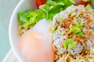 Chinese noodles with minced pork and egg in bowl
