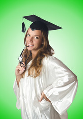 Young student with diploma on white