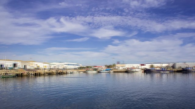 Pan Time Lapse in Olhao Fishing Port, the city capital of Ria Formosa wetlands natural park, Algarve, Portugal.