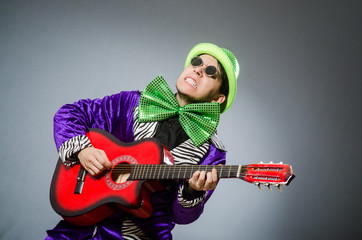 Funny man playing guitar in musical concept