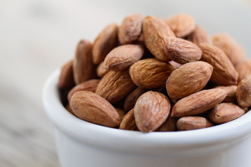 Bowl of Almond Nuts on Rustic Wooden Table