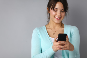 Woman using and reading a smart phone 