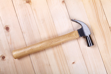 hammer on wood background