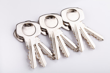 Set of old house keys  on white background