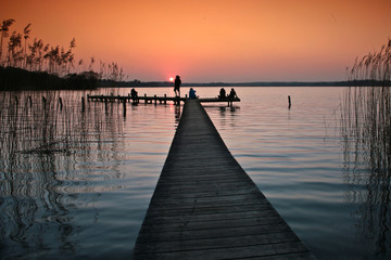 Fototapeta premium Lake in denmark with a jetty in winter shot with colour graduate